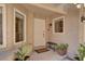 Inviting front porch with decorative plants and a well-maintained entrance, creating a welcoming atmosphere to the home at 5142 Southern Hills Ln, Las Vegas, NV 89113