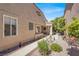 Inviting front yard with mature landscaping, a stone walkway and charming exterior; a tranquil approach to the home at 5142 Southern Hills Ln, Las Vegas, NV 89113