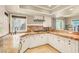 Bright kitchen with white cabinets, granite countertops and stainless steel appliances at 5142 Southern Hills Ln, Las Vegas, NV 89113