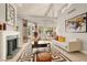 Bright living room featuring a fireplace, vaulted ceilings, and contemporary décor at 5142 Southern Hills Ln, Las Vegas, NV 89113
