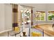 Bright living room features a patio door and nice backyard views at 5142 Southern Hills Ln, Las Vegas, NV 89113