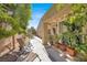 A nice outdoor patio area with various greenery and patio furniture at 5142 Southern Hills Ln, Las Vegas, NV 89113