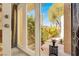 Charming outdoor patio with lush greenery, and a stylish table, perfect for relaxation and enjoying the serene surroundings at 5142 Southern Hills Ln, Las Vegas, NV 89113
