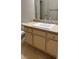 Bathroom featuring a vanity with beige countertops and paneled cabinets with a sink at 5250 S Rainbow Blvd # 1140, Las Vegas, NV 89118