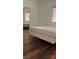 Bedroom with hard wood floors and a sliding mirrored closet door at 5250 S Rainbow Blvd # 1140, Las Vegas, NV 89118