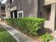 A residence with lush landscaping and a manicured hedge at 5250 S Rainbow Blvd # 1140, Las Vegas, NV 89118
