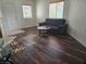 Living room features a comfortable sofa and hardwood flooring at 5250 S Rainbow Blvd # 1140, Las Vegas, NV 89118