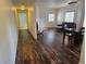 View of a warm living room with hardwood floors and ample natural light throughout the home at 5250 S Rainbow Blvd # 1140, Las Vegas, NV 89118