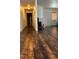 Living room with wood flooring, neutral walls, fireplace, and natural light from the window at 5250 S Rainbow Blvd # 1140, Las Vegas, NV 89118