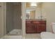 Modern bathroom featuring a tiled shower, granite vanity, and toilet at 5383 Indian River Dr # 323, Las Vegas, NV 89103