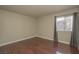 Bright, airy bedroom with hardwood floors and a large window bringing in natural light at 5383 Indian River Dr # 323, Las Vegas, NV 89103
