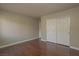 Bedroom with hardwood flooring, double door closet, neutral walls and white trim at 5383 Indian River Dr # 323, Las Vegas, NV 89103
