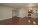 Large living room with hardwood floors and open access to the kitchen and stainless steel appliances at 5383 Indian River Dr # 323, Las Vegas, NV 89103