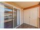 A covered outdoor patio features tiled floors and sliding glass doors at 5383 Indian River Dr # 323, Las Vegas, NV 89103