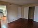 Bedroom features wood floors, closet, and easy access to the adjacent kitchen and living area at 555 E Silverado Ranch Blvd # 2052, Las Vegas, NV 89183