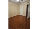 The primary bedroom has wood floors, closet space, and neutral wall color at 555 E Silverado Ranch Blvd # 2052, Las Vegas, NV 89183