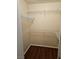 A walk-in closet featuring wood floors and white wire shelving offers practical storage solutions at 555 E Silverado Ranch Blvd # 2052, Las Vegas, NV 89183