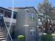 Exterior view of a multi-story condo building with a staircase, balconies, and well-maintained landscaping at 555 E Silverado Ranch Blvd # 2052, Las Vegas, NV 89183