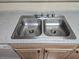 Featuring a stainless steel double sink and a spotless countertop, perfect for meal preparation at 555 E Silverado Ranch Blvd # 2052, Las Vegas, NV 89183