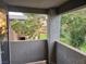 A covered patio overlooking a green area, trees, and other nearby homes at 555 E Silverado Ranch Blvd # 2052, Las Vegas, NV 89183