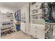 Organized walk-in closet with built-in shelves and drawers for ample storage at 56 Grossinger Ct, Henderson, NV 89074