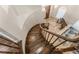 Elegant entryway with a curved staircase, tile flooring, and a view into the living area at 56 Grossinger Ct, Henderson, NV 89074