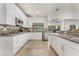 Well-lit kitchen featuring granite countertops, stainless steel appliances and custom cabinetry for a modern feel at 56 Grossinger Ct, Henderson, NV 89074