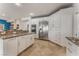 Spacious kitchen with a large island, stainless steel appliances, and ample cabinet space for storage at 56 Grossinger Ct, Henderson, NV 89074