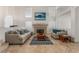 Bright living room with high ceilings and a cozy fireplace creates an inviting atmosphere for relaxation at 56 Grossinger Ct, Henderson, NV 89074