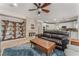 Comfortable living room features a fireplace, modern furniture, and an open floorplan to the kitchen at 56 Grossinger Ct, Henderson, NV 89074