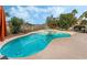 Inviting pool and spa combination with clear blue water and mature landscaping at 56 Grossinger Ct, Henderson, NV 89074