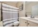 Cozy bathroom features a shower-tub combo and a single sink vanity with great lighting at 5662 Oak Bend Dr, Las Vegas, NV 89135