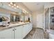 Primary bathroom features double sinks, a walk-in shower, and a soaking tub at 5662 Oak Bend Dr, Las Vegas, NV 89135