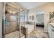 Bright primary bathroom features a walk-in shower, soaking tub, and neutral finishes at 5662 Oak Bend Dr, Las Vegas, NV 89135