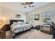 Neutral bedroom with a queen-sized bed, natural light, and neutral carpet at 5662 Oak Bend Dr, Las Vegas, NV 89135