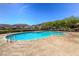 This community pool features plenty of seating and shade for residents at 5662 Oak Bend Dr, Las Vegas, NV 89135