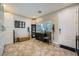 Foyer featuring tile flooring, storage cabinets, and a view of the front door and window at 5662 Oak Bend Dr, Las Vegas, NV 89135