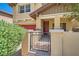 This covered front porch features manicured bushes and stonework at 5662 Oak Bend Dr, Las Vegas, NV 89135