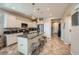 Bright kitchen features a granite island with seating and white cabinets offering lots of storage at 5662 Oak Bend Dr, Las Vegas, NV 89135