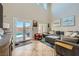 Living room with lots of natural light, large sectional and view of the patio at 5662 Oak Bend Dr, Las Vegas, NV 89135
