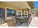 This outdoor dining area features a stone patio and outdoor seating for six at 5662 Oak Bend Dr, Las Vegas, NV 89135