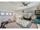 This playroom features a ceiling fan, natural light and a play area at 5662 Oak Bend Dr, Las Vegas, NV 89135