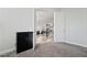 View of open-concept living space, showcasing modern furniture and natural light from the entryway at 5684 Benevento Ct, Las Vegas, NV 89141