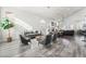 Spacious and bright open-concept living area with modern furnishings and plenty of natural light at 5684 Benevento Ct, Las Vegas, NV 89141