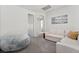 Comfortable loft featuring a modular sofa, beanbag chair, and bright neutral tones at 5684 Benevento Ct, Las Vegas, NV 89141