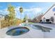 Inviting backyard pool and spa combo with mature landscaping and an outdoor living area for entertaining at 5684 Benevento Ct, Las Vegas, NV 89141