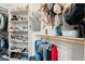 A well-organized walk-in closet features storage shelves and plenty of room for hanging clothes at 5684 Benevento Ct, Las Vegas, NV 89141
