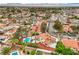 A high-angle captures a neighborhood with homes that include pools and landscaping under a desert sky at 5757 Charles Holden Ct, Las Vegas, NV 89103