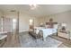 Well-appointed primary bedroom with stylish decor, a comfortable bed, and ample space, providing a serene atmosphere at 5757 Charles Holden Ct, Las Vegas, NV 89103