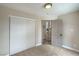Cozy bedroom featuring a closet and doorway, neutral walls and carpeting providing a blank canvas for personalization at 5757 Charles Holden Ct, Las Vegas, NV 89103